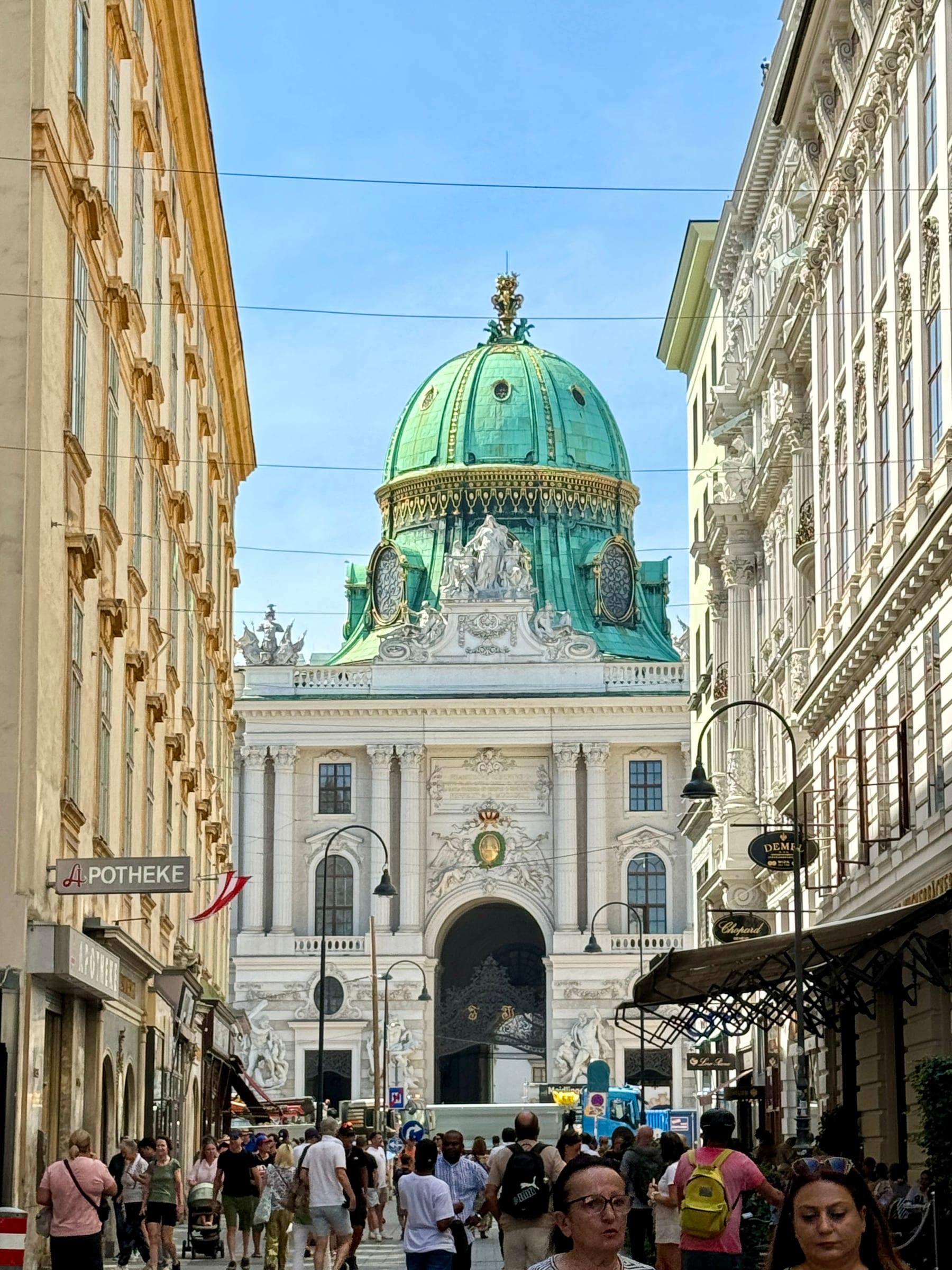 Hofburg Palace dome through narrow Vienna street